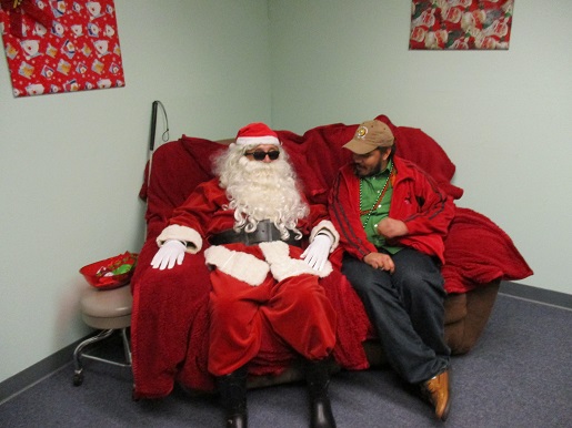 Blind Santa and a man sitting together